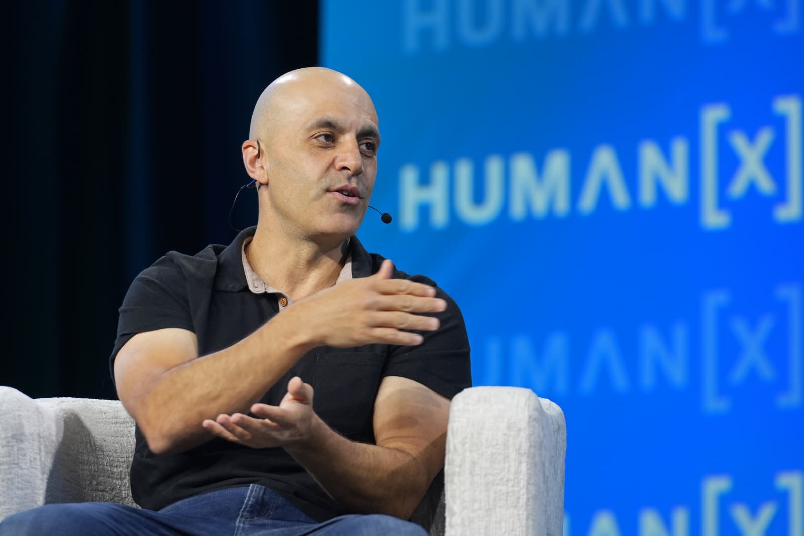 Databricks CEO Ali Ghodsi speaking at the HumanX conference in San Francisco, photographed by Big Event Media