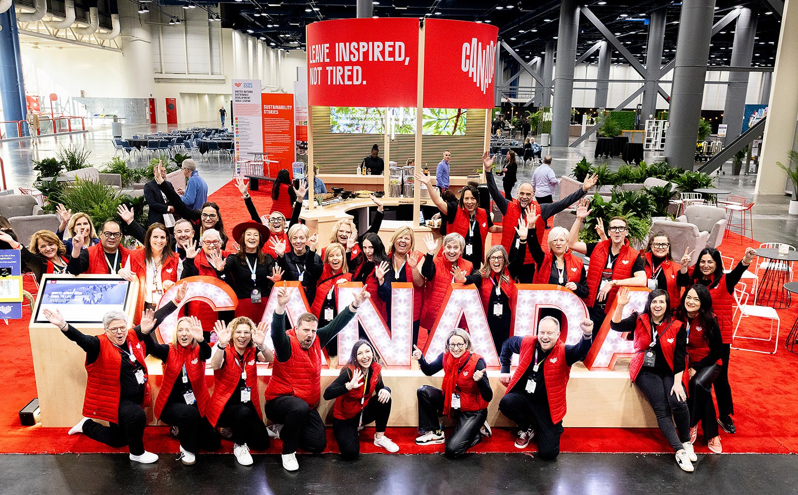 Sponsor activation team celebrating on the show floor