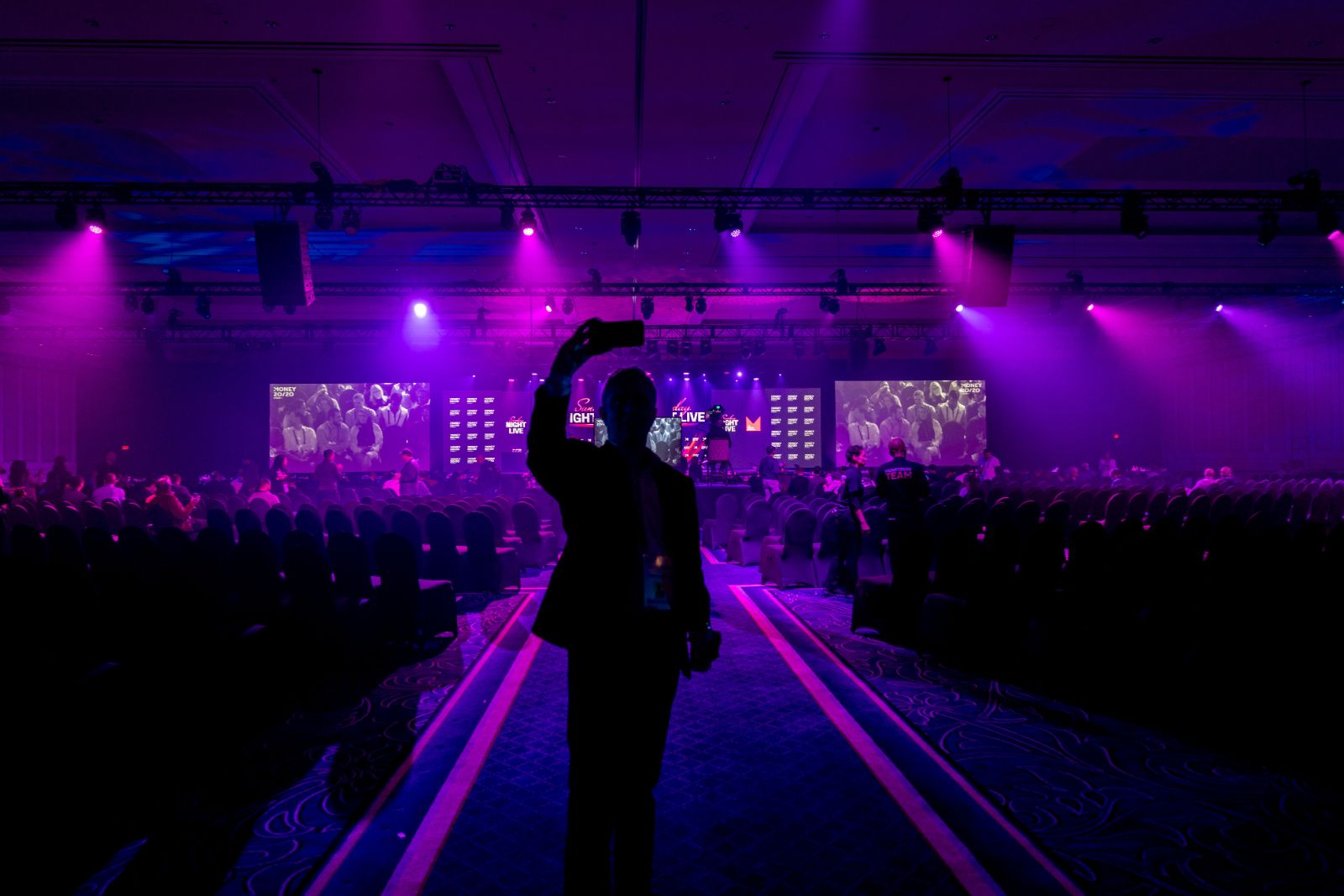 The Money20/20 USA keynote hall in purple and pink stage lighting, photographed by Big Event Media