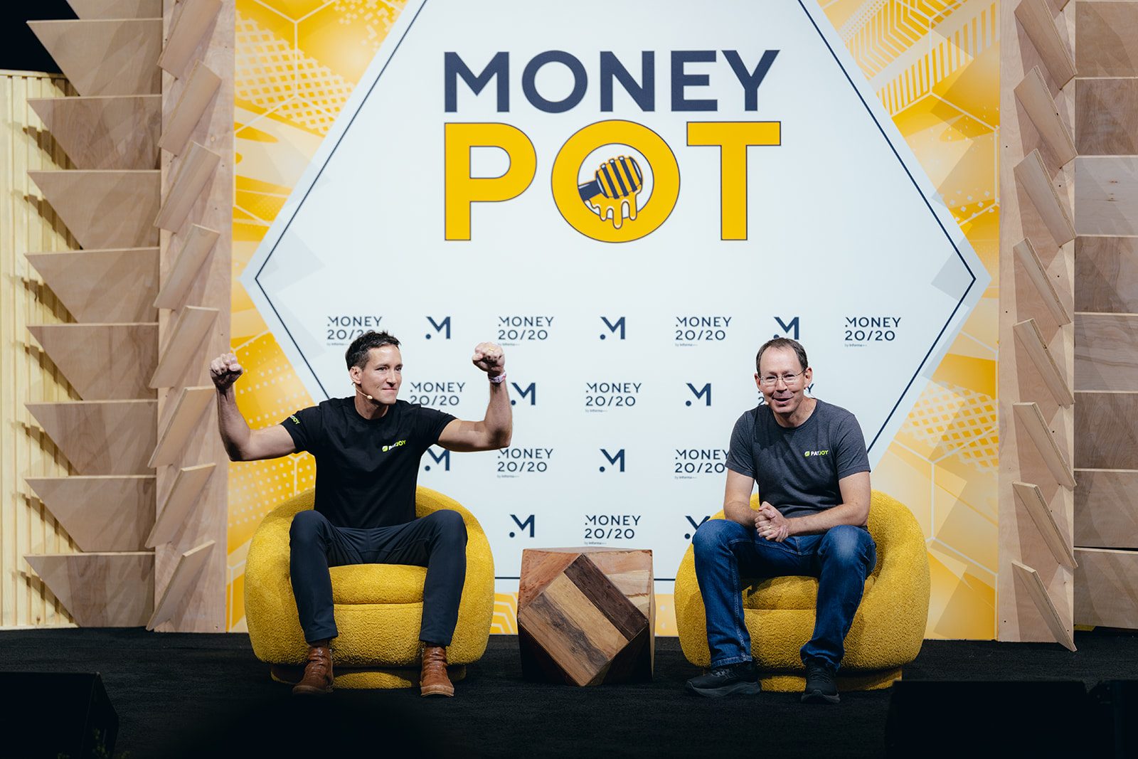 The Money Pot networking lounge with hanging honey-dipper signage at Money20/20